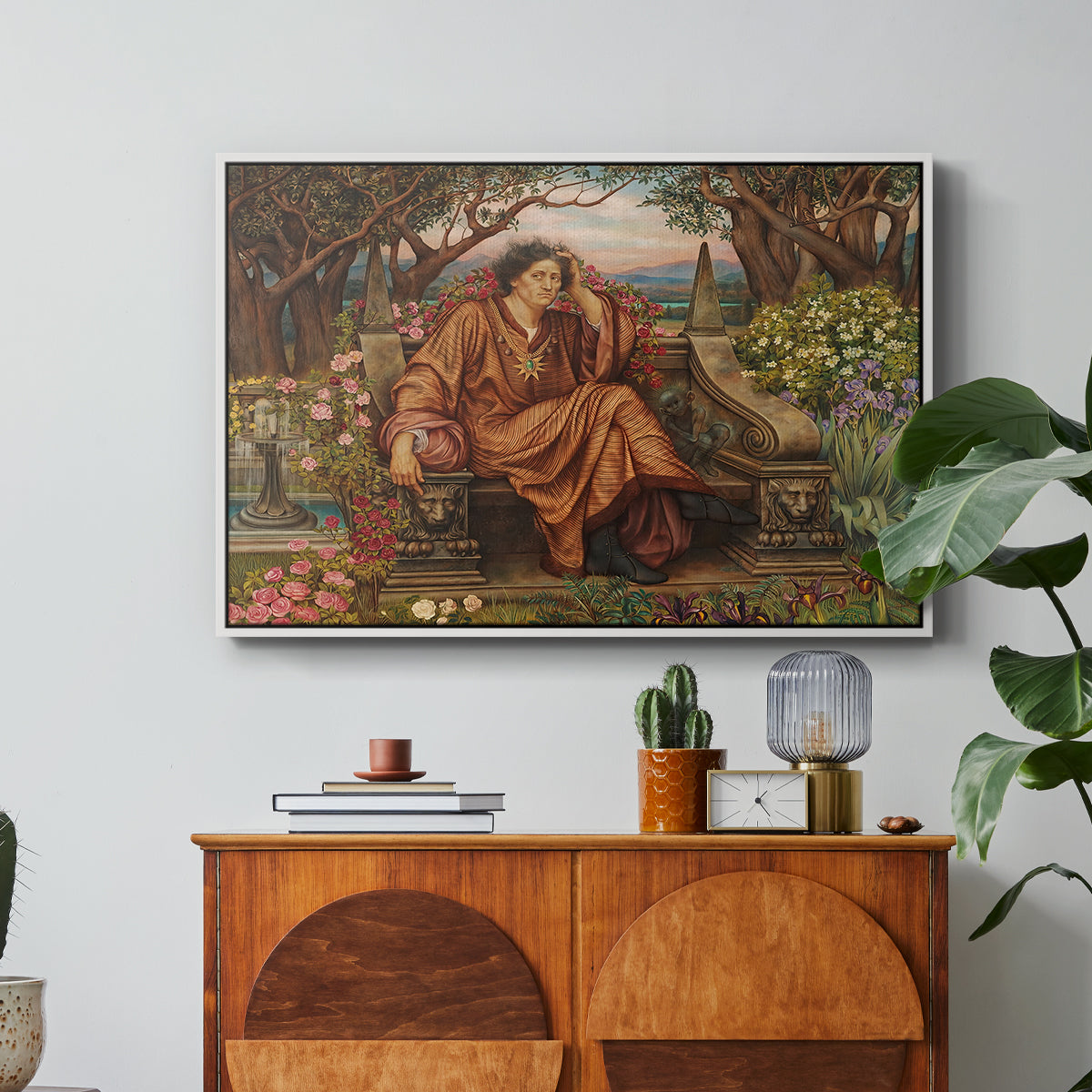 A Soul in Hell, c. 1901-1902 by Evelyn De Morgan in a white floater framed canvas featuring a distressed figure surrounded by flames and torment in symbolic hell scene, displayed above a wood console cabinet.