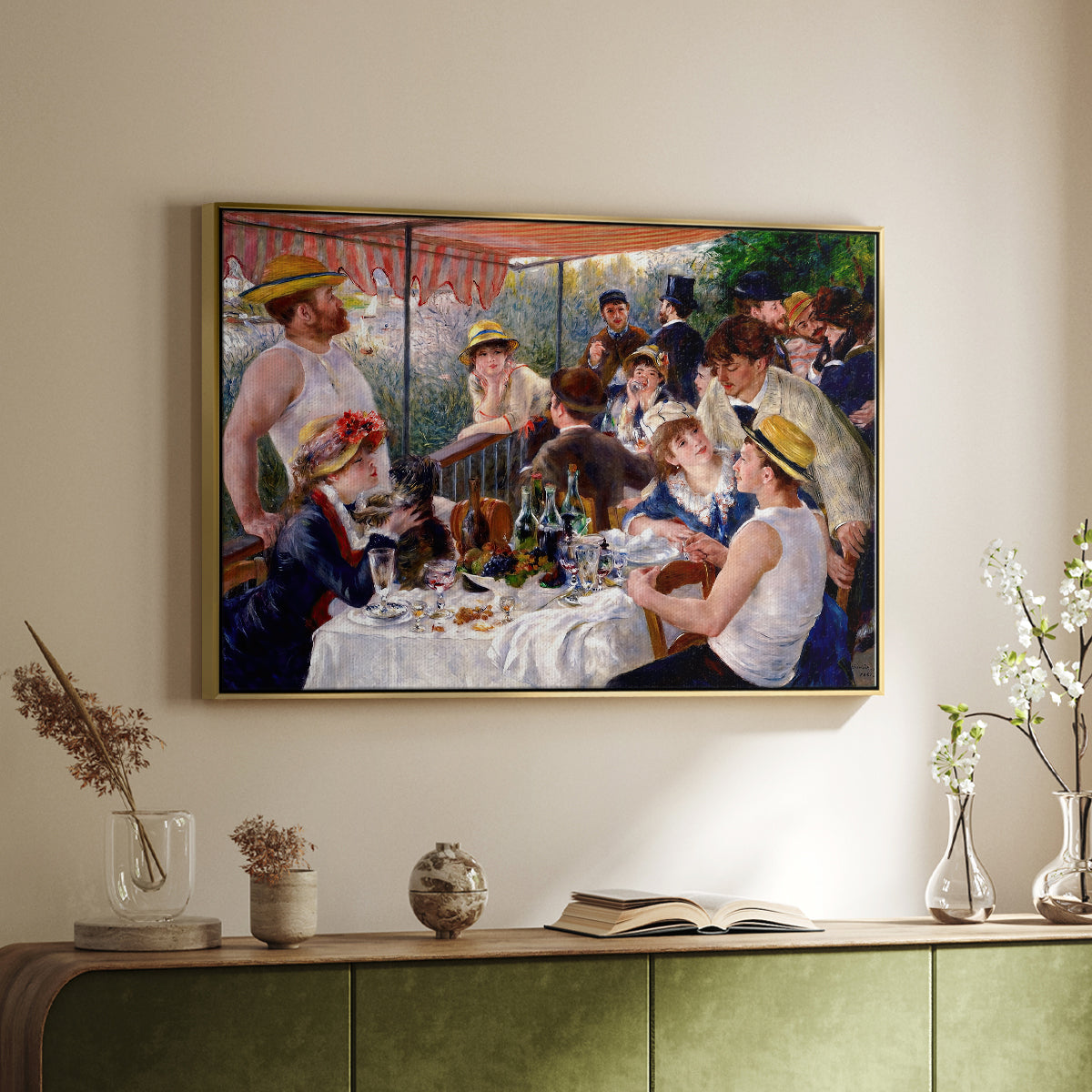Gold floater framed canvas of Luncheon of the Boating Party (Le Déjeuner des canotiers), 1880-1881 by Pierre-Auguste Renoir, featuring a lively gathering of men and women eating and socializing at outdoor table above a sideboard in a softly lit hallway.
