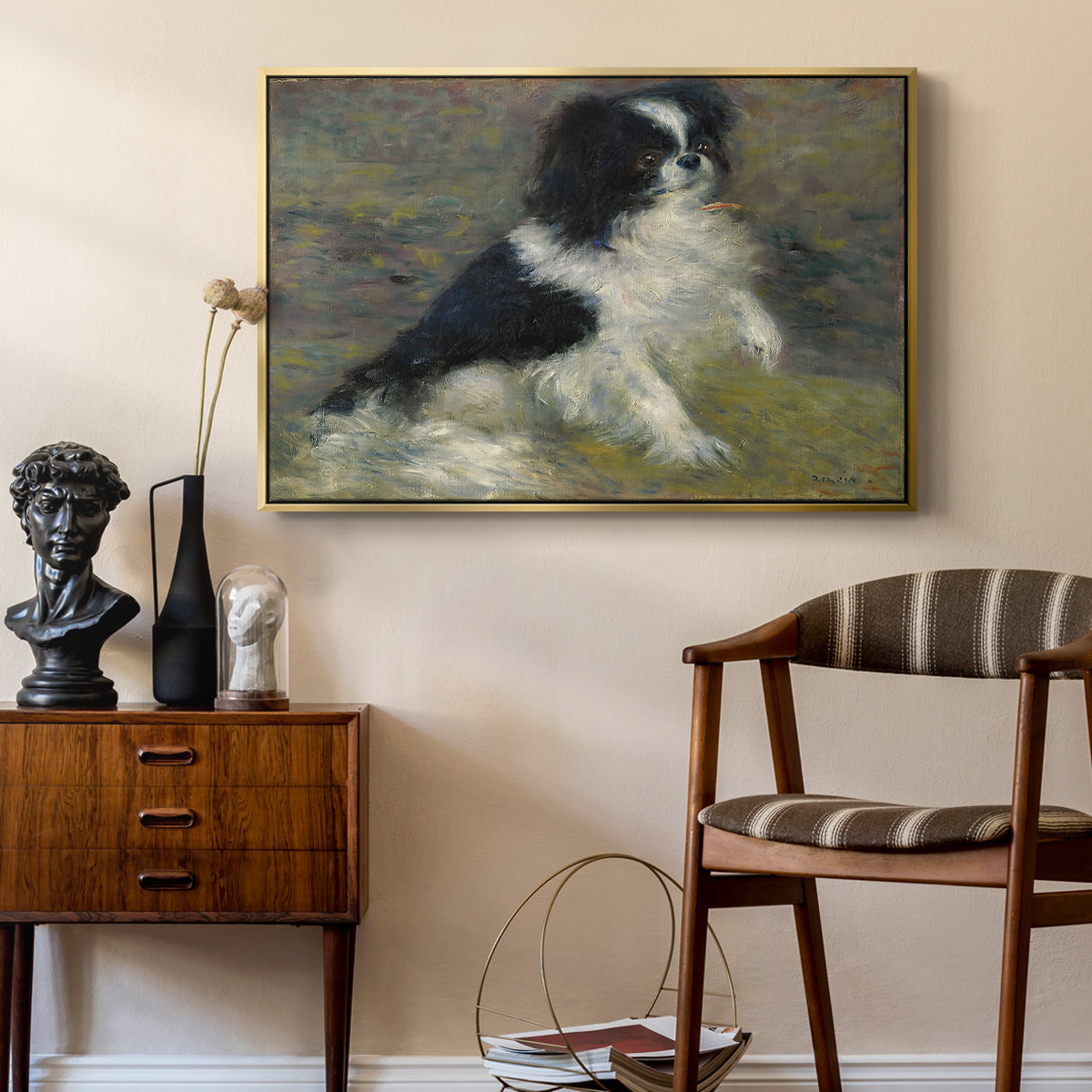 Tama, the Japanese Dog, c. 1876 by Pierre-Auguste Renoir as a gold floater framed canvas featuring a close-up of a small dog in motion surrounded by rippling water, styled above a mid-century console in a contemporary living area.