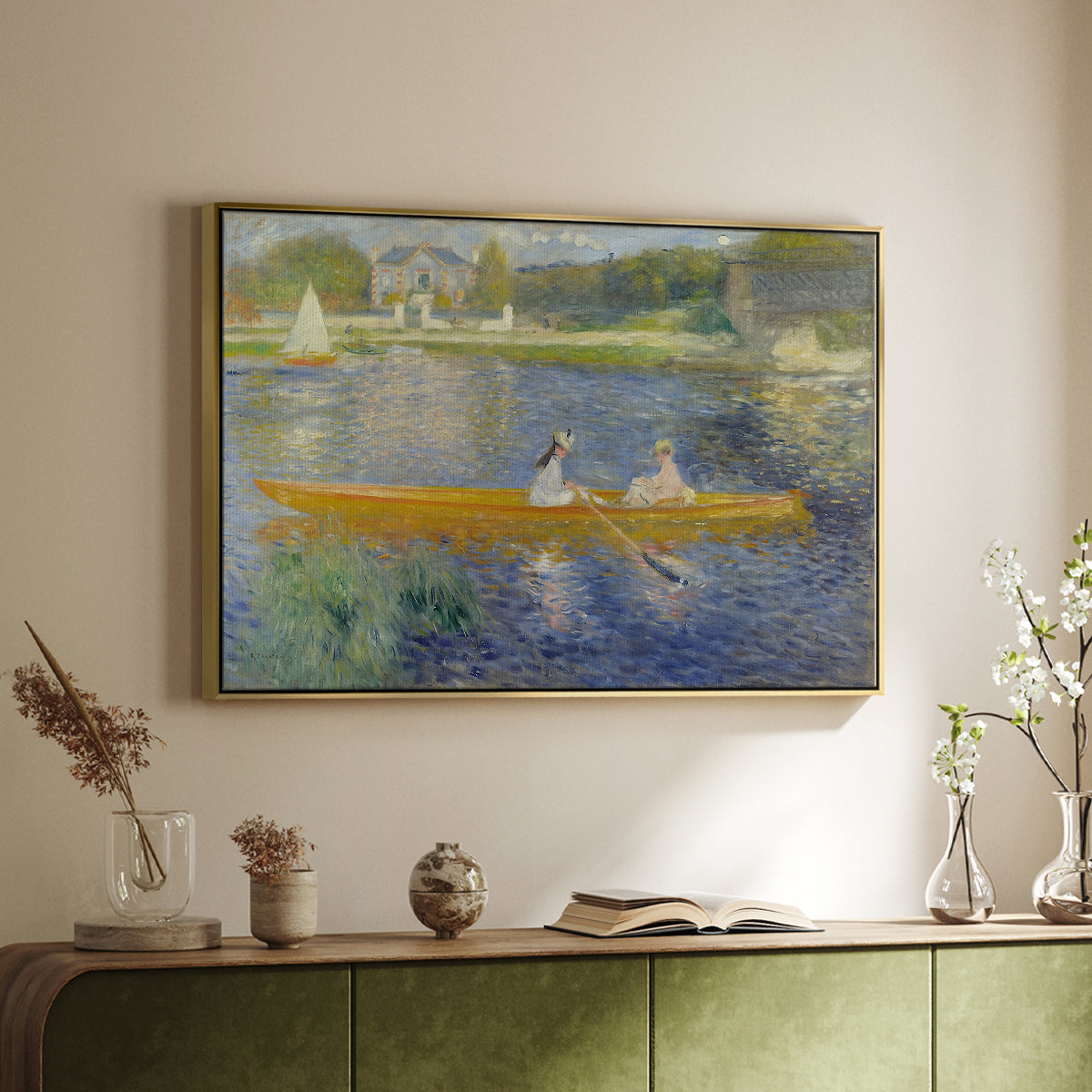 Gold floater framed canvas of The Skiff (La Yole), 1875 by Pierre-Auguste Renoir, featuring an impressionist boating scene with people relaxing in a narrow skiff above a sideboard in a softly lit hallway.