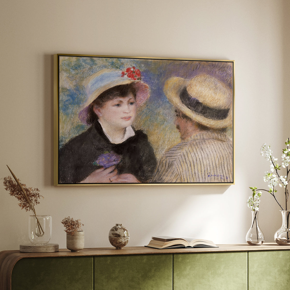 Gold floater framed canvas of Boating Couple (Aline Charigot and Renoir), c. 1881 by Pierre-Auguste Renoir, featuring an intimate portrait of man and woman sitting side by side in outdoor setting above a sideboard in a softly lit hallway.