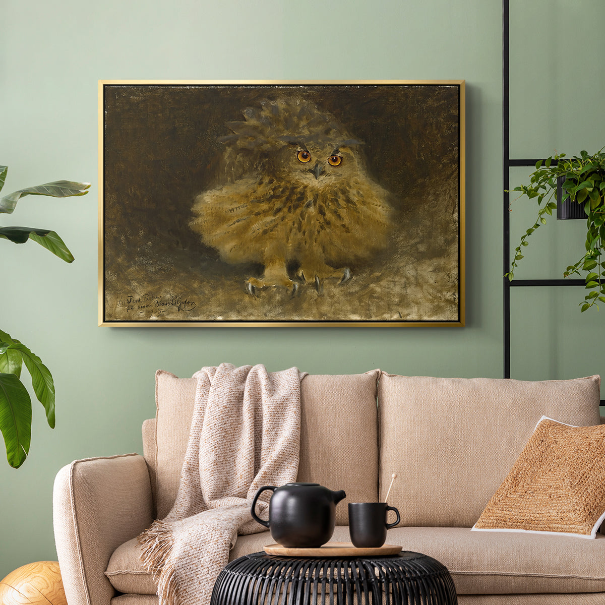 Gold floater framed canvas featuring a realistic depiction of owl camouflaged within woodland environment, displayed above a sofa in a modern living room.