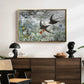Common Swifts, 1886 by Bruno Liljefors displayed in a gold floater framed canvas above a dark wood credenza in an entryway.
