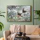 Gold floater framed canvas featuring an impressionist wildlife scene capturing birds in motion, displayed above a sofa in a modern living room.