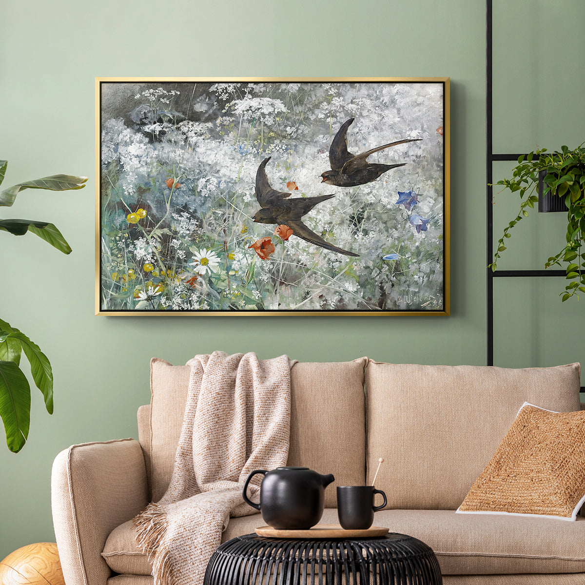Gold floater framed canvas featuring an impressionist wildlife scene capturing birds in motion, displayed above a sofa in a modern living room.