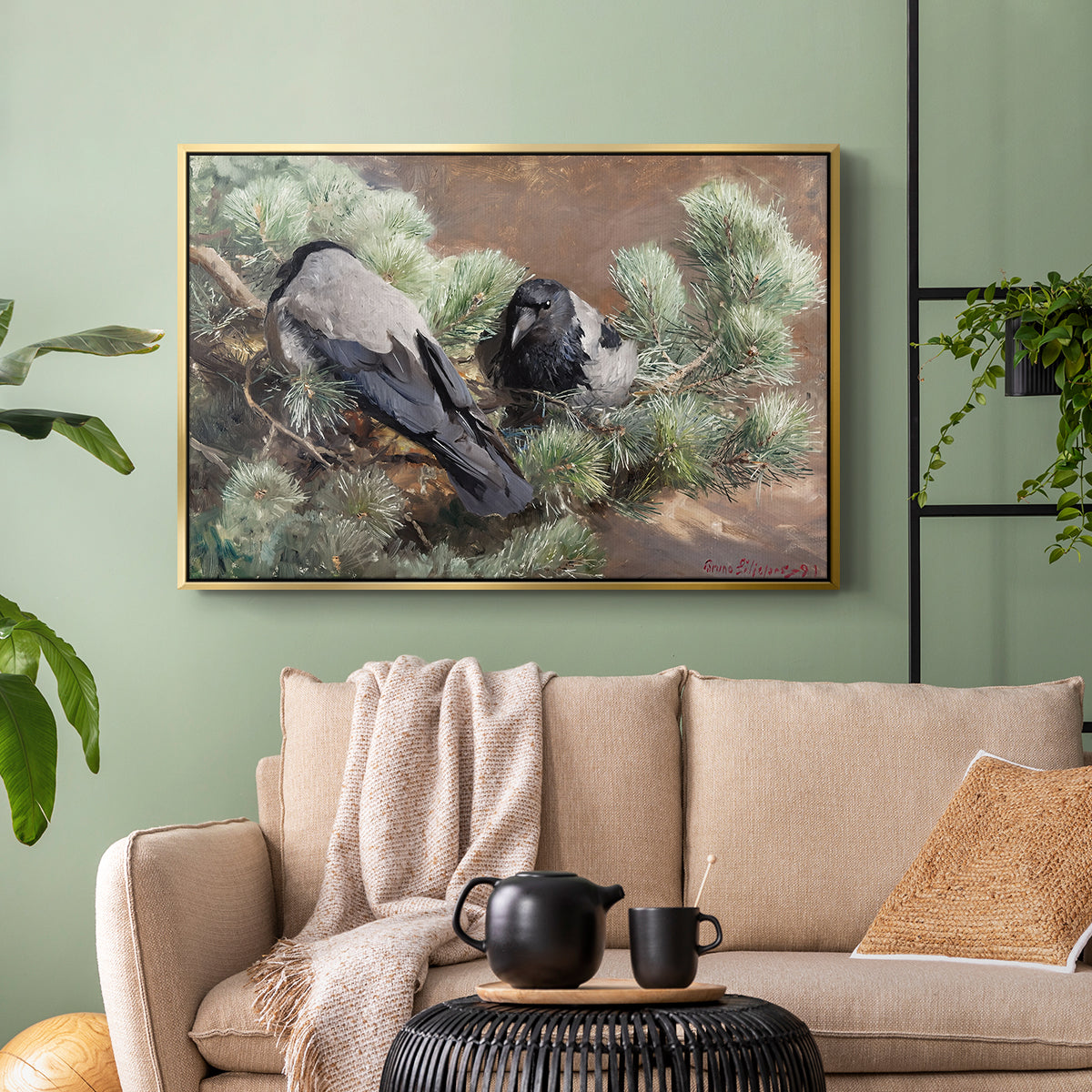Gold floater framed canvas featuring a wildlife painting of dark birds against muted landscape, displayed above a sofa in a modern living room.