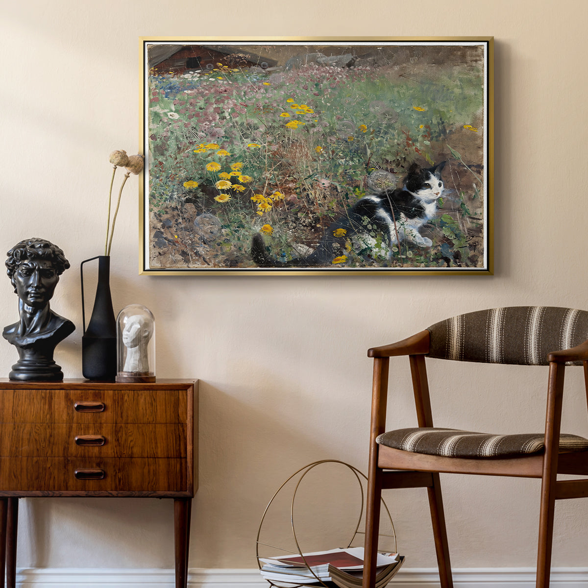 Cat on a Flowery Meadow, 1887 by Bruno Liljefors as a gold floater framed canvas featuring an animal scene of cat hidden in lush meadow vegetation, styled above a mid-century console in a contemporary living area.