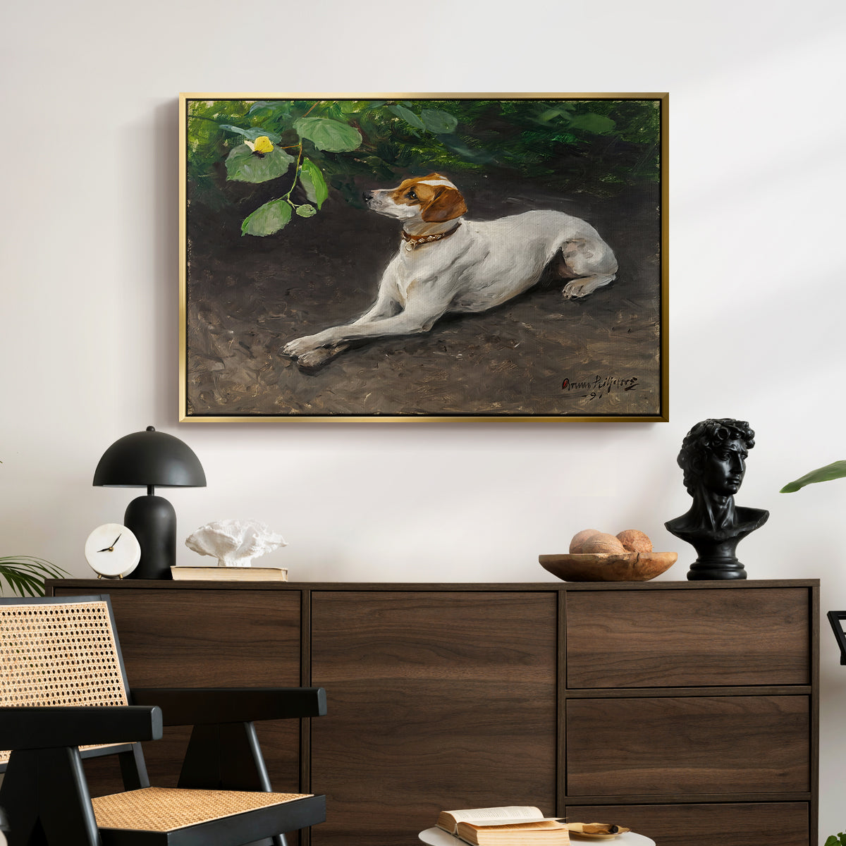 Portrait of a Dog, 1891 by Bruno Liljefors displayed in a gold floater framed canvas above a dark wood credenza in an entryway.