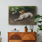 Portrait of a Dog, 1891 by Bruno Liljefors in a gold floater framed canvas featuring a dog lying on ground with head raised in natural outdoor setting, displayed above a wood console cabinet.