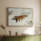 Gold floater framed canvas of Fox in Snow Landscape, 1900 by Bruno Liljefors, featuring a wildlife scene of fox moving swiftly through winter terrain above a sideboard in a softly lit hallway.