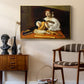 The Lute Player (Wildenstein Version), c. 1596 by Caravaggio as a gold floater framed canvas featuring a detailed scene of youth playing string instrument with fruit and flowers nearby, styled above a mid-century console in a contemporary living area.