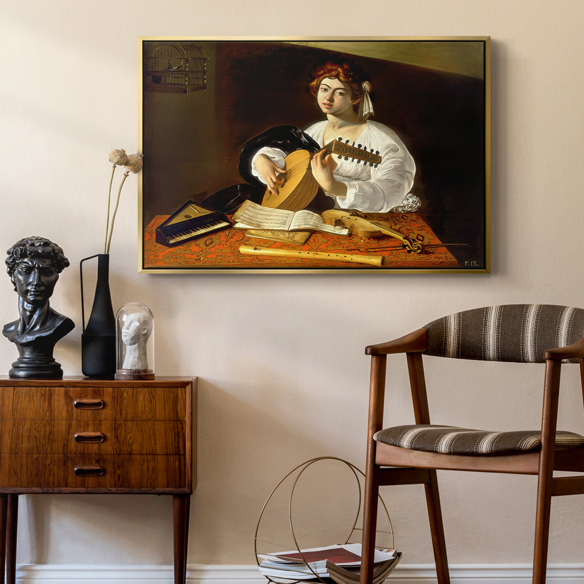 The Lute Player (Wildenstein Version), c. 1596 by Caravaggio as a gold floater framed canvas featuring a detailed scene of youth playing string instrument with fruit and flowers nearby, styled above a mid-century console in a contemporary living area.