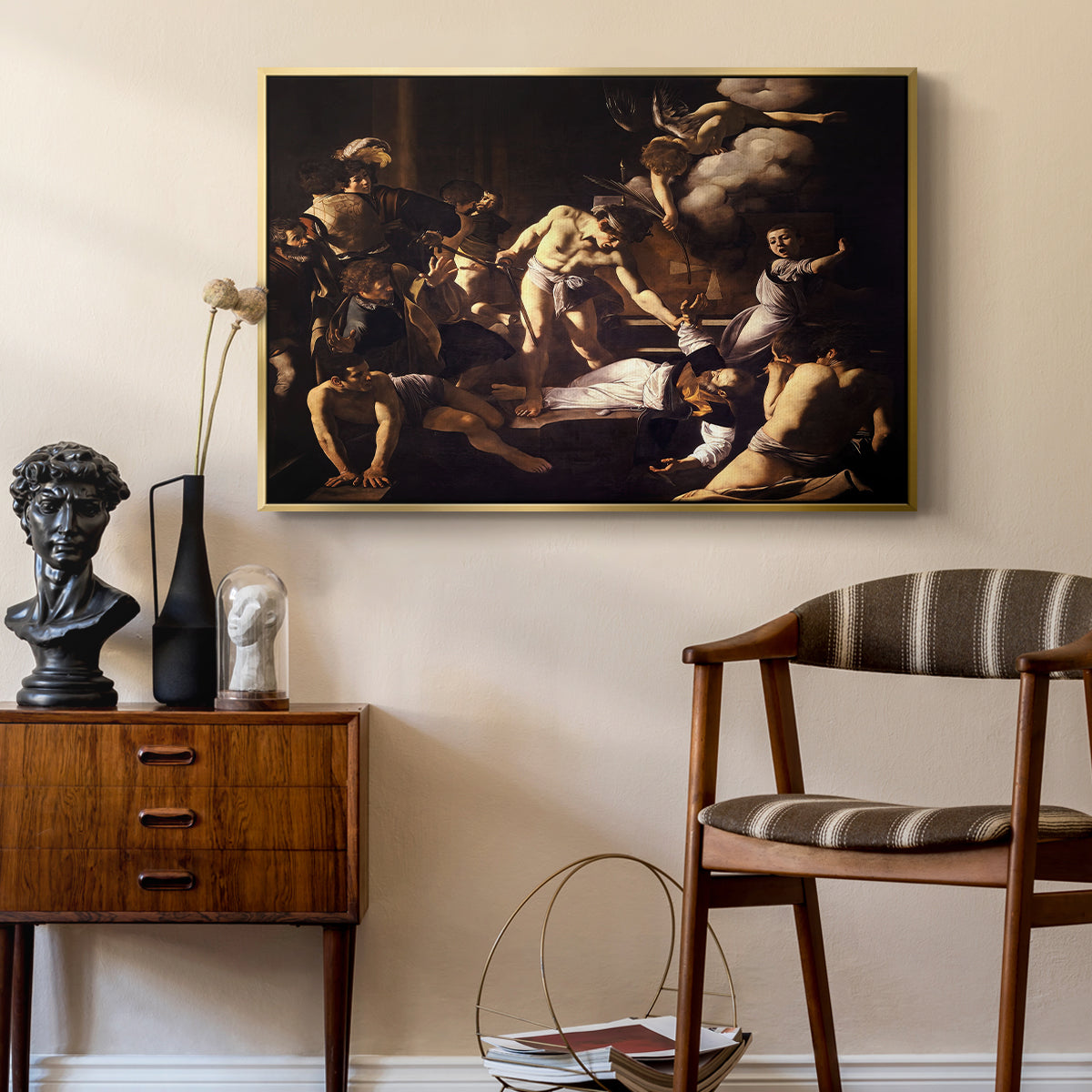 The Martyrdom of Saint Matthew, 1599-1600 by Caravaggio as a gold floater framed canvas featuring a religious narrative showing violent attack on saint in crowded setting, styled above a mid-century console in a contemporary living area.
