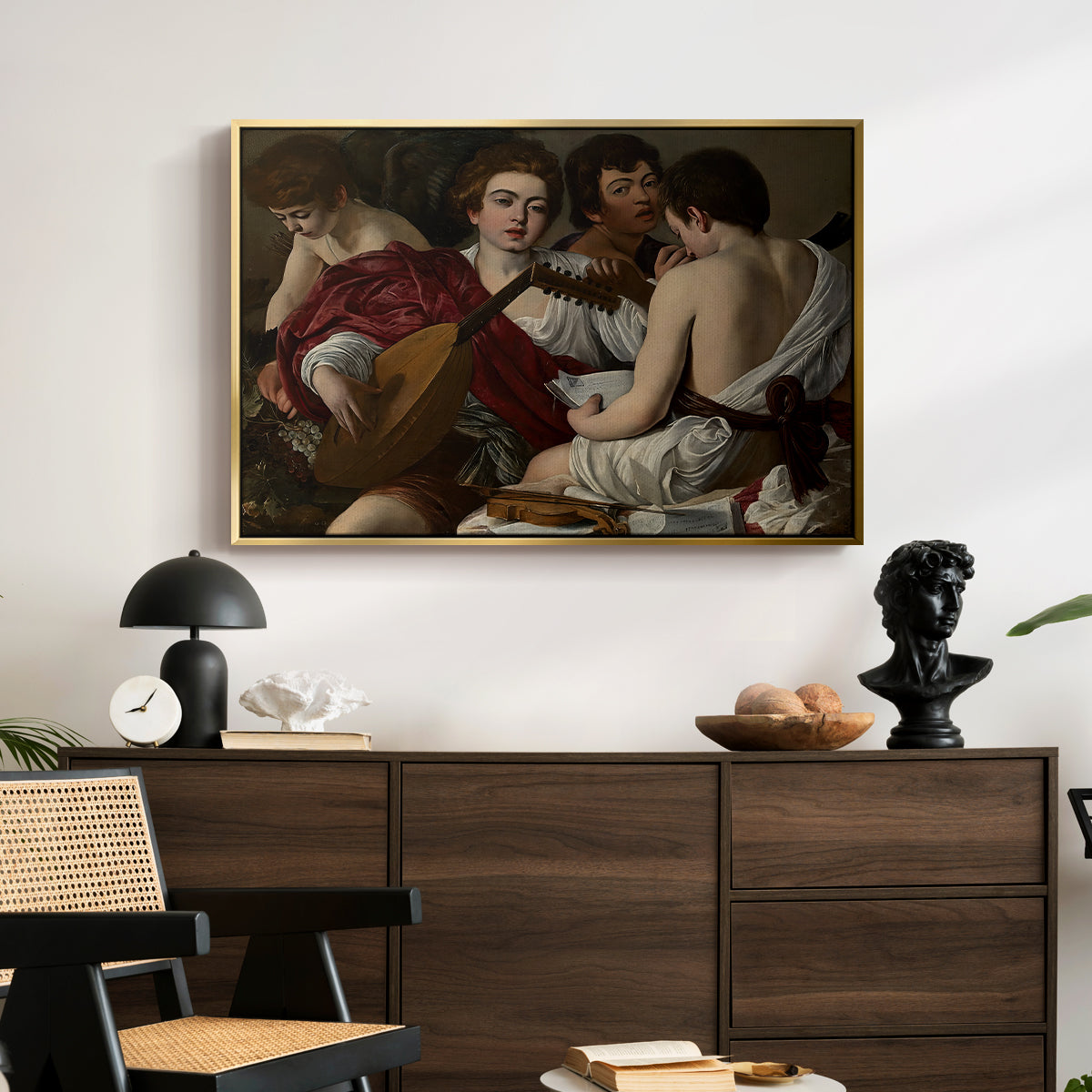 The Musicians, c. 1595 by Caravaggio displayed in a gold floater framed canvas above a dark wood credenza in an entryway.