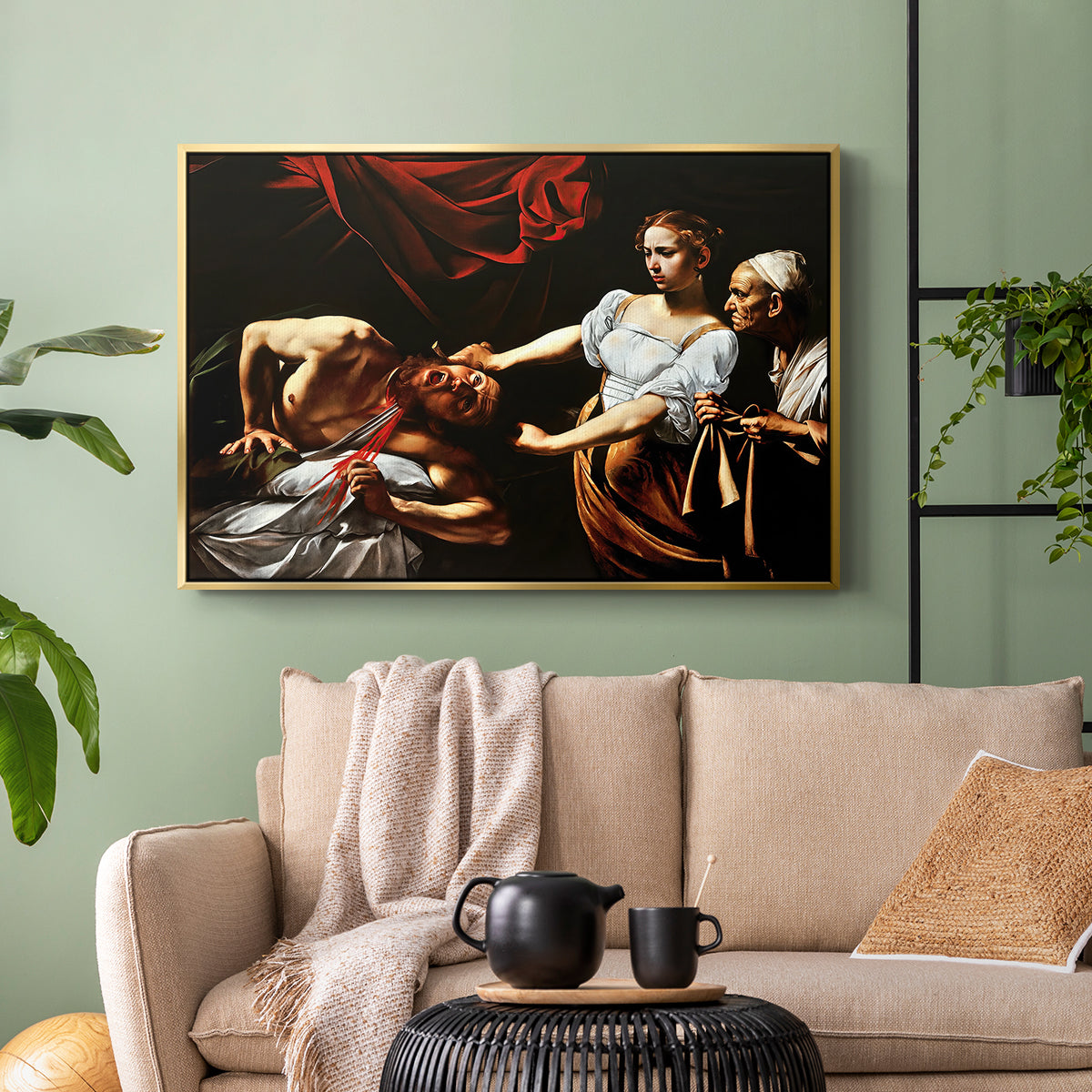 Gold floater framed canvas featuring a violent religious narrative with strong contrast of light and shadow, displayed above a sofa in a modern living room.