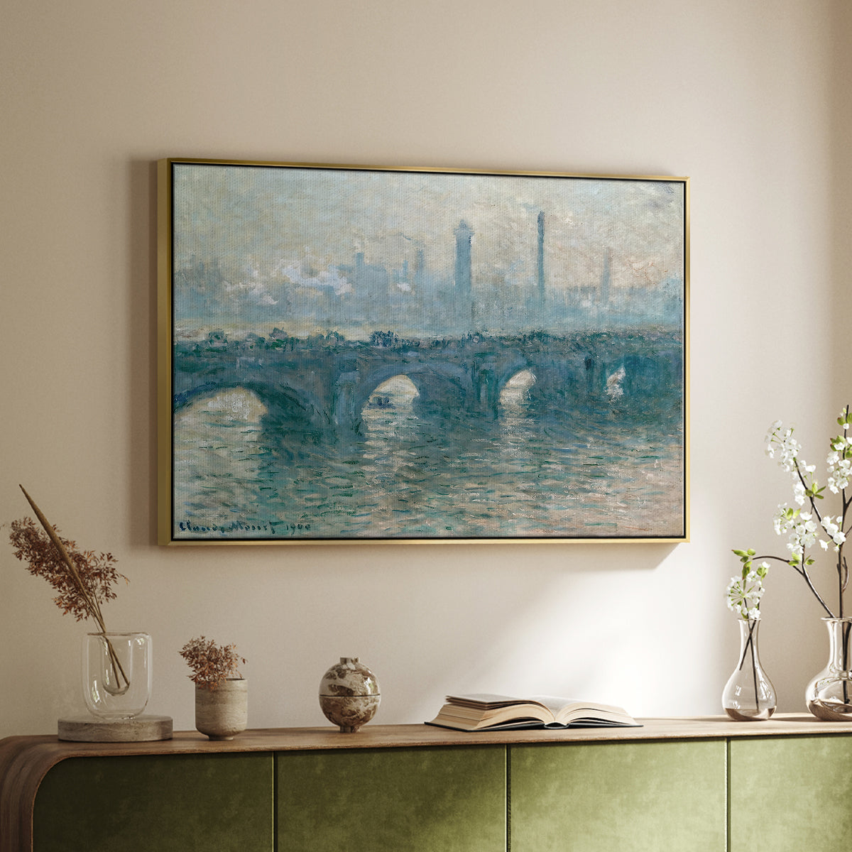 Gold floater framed canvas of Waterloo Bridge, Gray Weather, 1900 by Claude Monet, featuring an impressionist cityscape with bridge fading into fog over water above a sideboard in a softly lit hallway.