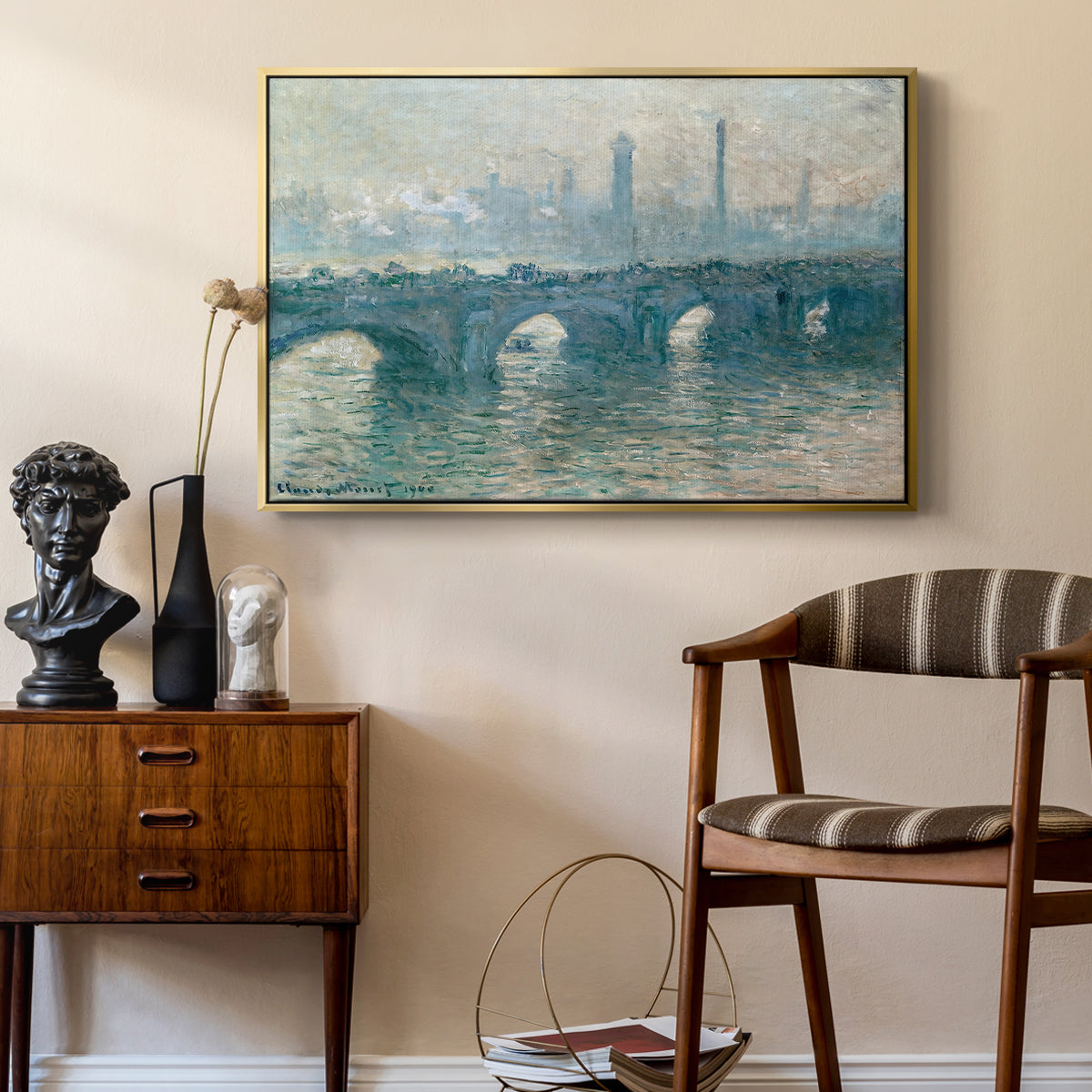 Waterloo Bridge, Gray Weather, 1900 by Claude Monet as a gold floater framed canvas featuring a soft-toned river scene with bridge and muted skyline, styled above a mid-century console in a contemporary living area.