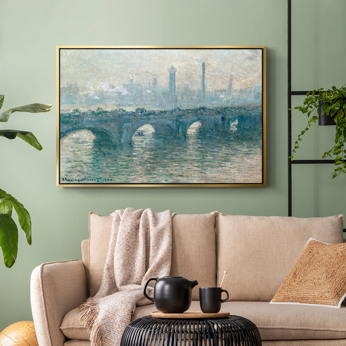 Gold floater framed canvas featuring an atmospheric urban landscape with misty light and reflections, displayed above a sofa in a modern living room.