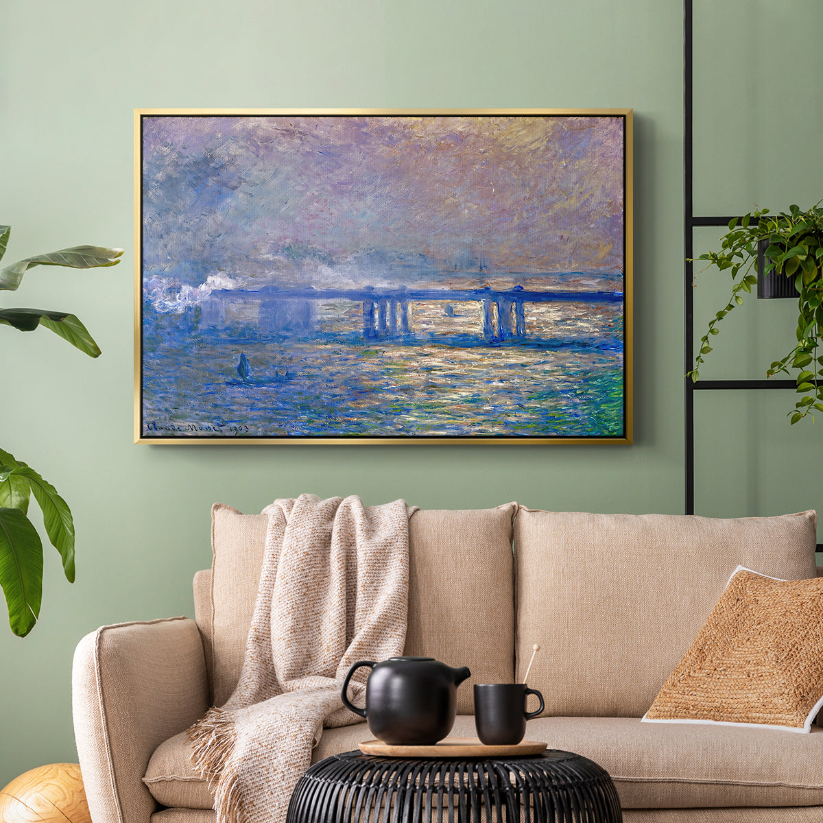 Gold floater framed canvas featuring a city bridge scene softened by mist and impressionist brushwork, displayed above a sofa in a modern living room.
