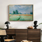 The Wheat Field (Champ de Blé), 1881 by Claude Monet displayed in a gold floater framed canvas above a dark wood credenza in an entryway.
