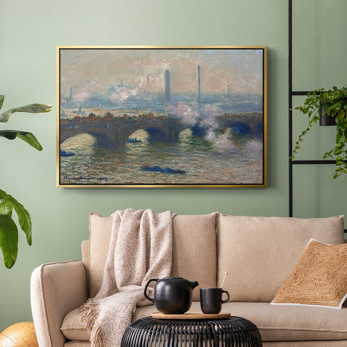 Gold floater framed canvas featuring a foggy London bridge view with softened architectural forms, displayed above a sofa in a modern living room.