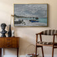 The Beach at Sainte-Adresse, 1867 by Claude Monet as a gold floater framed canvas featuring a coastal landscape with sailboats and visitors on cliffside, styled above a mid-century console in a contemporary living area.