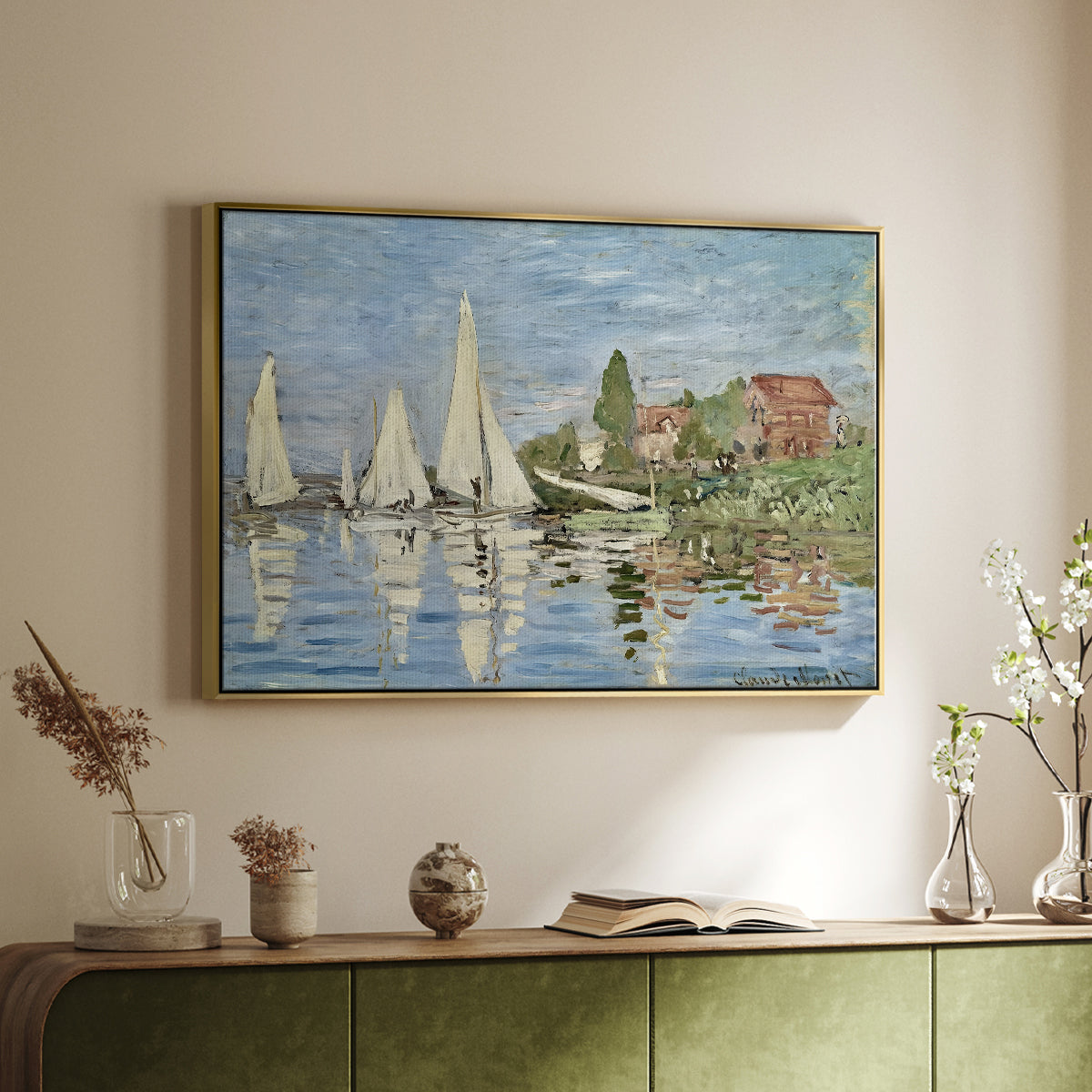 Gold floater framed canvas of Regatta at Argenteuil, 1872 by Claude Monet, featuring a lively regatta scene with multiple boats and fluttering sails above a sideboard in a softly lit hallway.