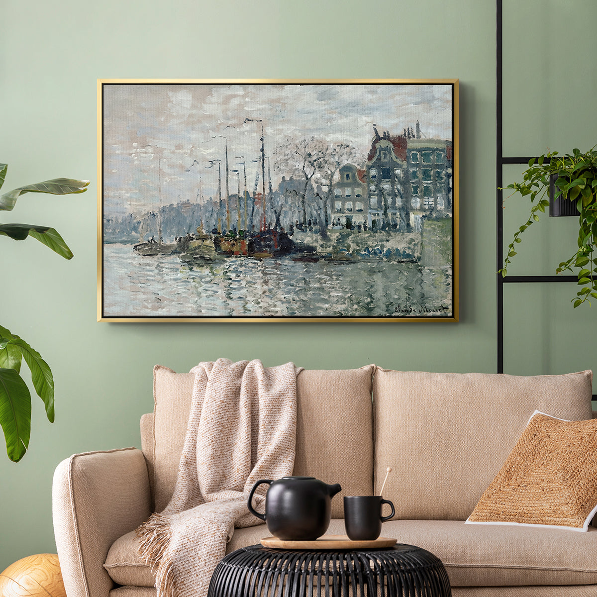 Gold floater framed canvas featuring a harbor view with masts, houses, and reflections in water, displayed above a sofa in a modern living room.