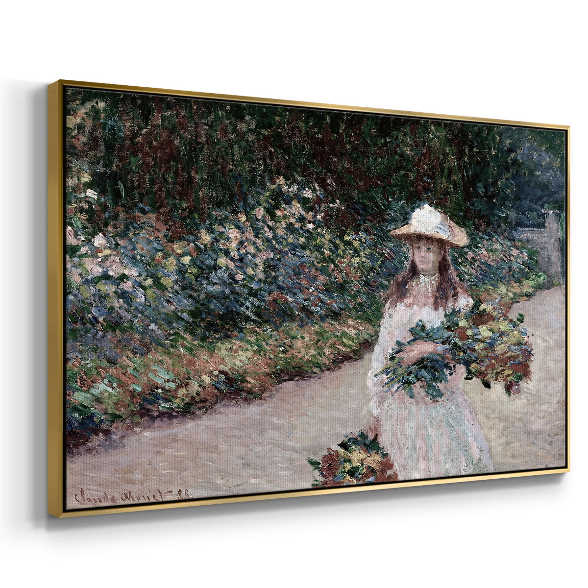 Angled view of Young Girl in the Garden at Giverny, 1888 by Claude Monet in a gold floater framed canvas.