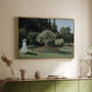 Gold floater framed canvas of Woman in the Garden, Sainte-Adresse, 1867 by Claude Monet, featuring an impressionist figure in sunlit garden with lush vegetation above a sideboard in a softly lit hallway.