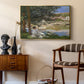 On the Bank of the Seine, Bennecourt, 1868 by Claude Monet as a gold floater framed canvas featuring an impressionist landscape with people relaxing along the Seine, styled above a mid-century console in a contemporary living area.