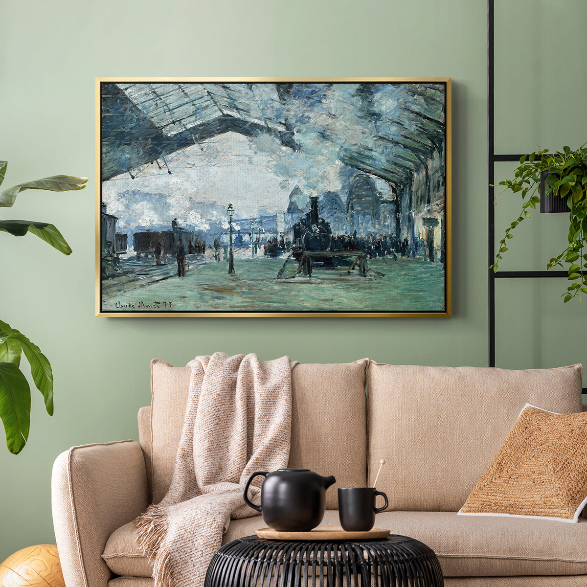 Gold floater framed canvas featuring a dramatic depiction of industrial space with trains and light, displayed above a sofa in a modern living room.
