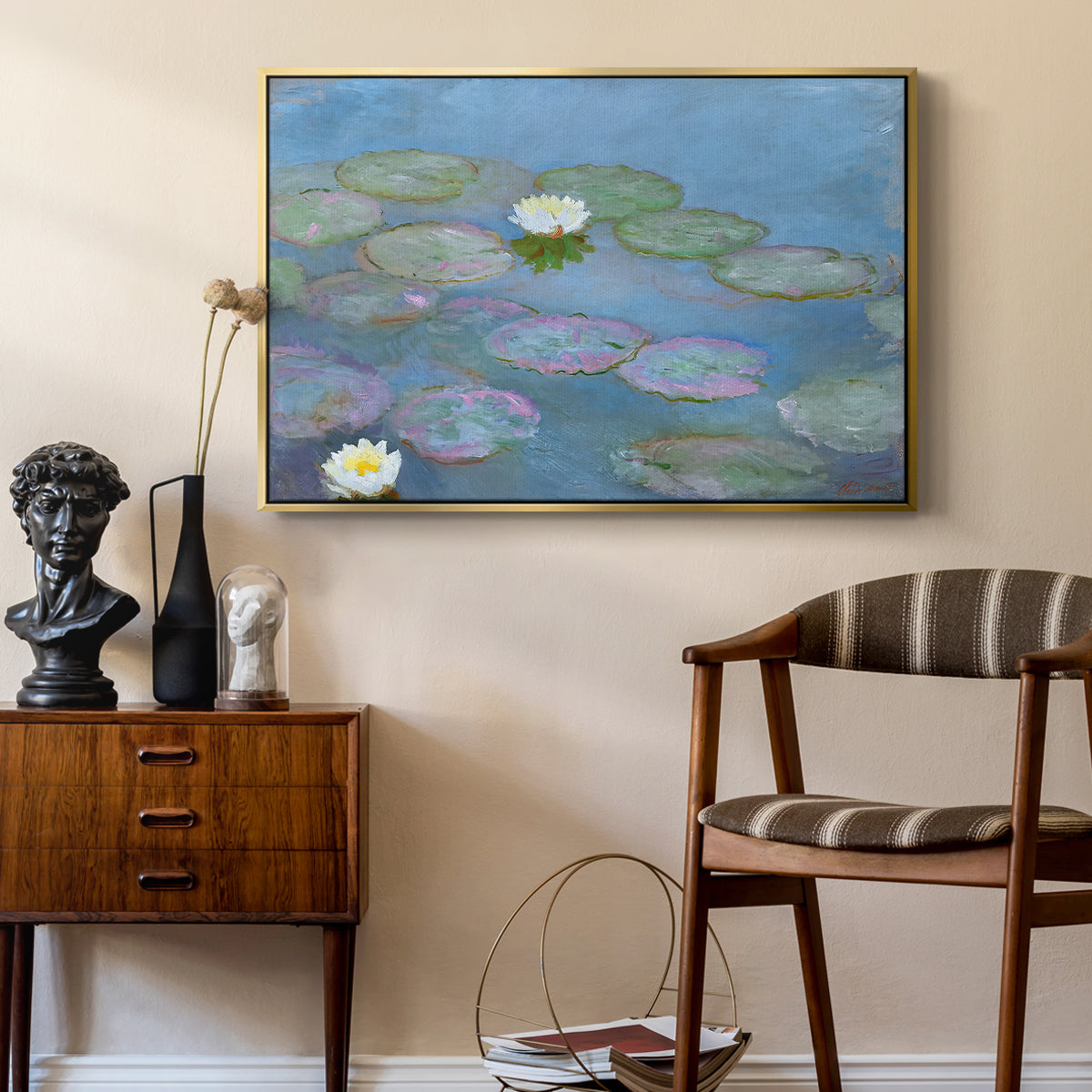 Water Lilies (Nymphéas), 1897-1899 by Claude Monet as a gold floater framed canvas featuring a tranquil water surface covered with blooming lilies, styled above a mid-century console in a contemporary living area.