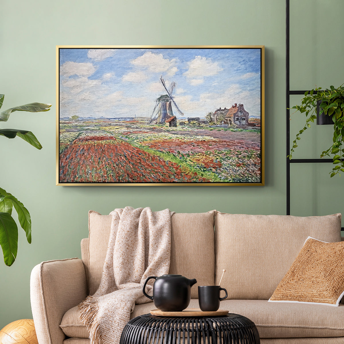 Gold floater framed canvas featuring a rural scene with patterned rows of flowers and windmill, displayed above a sofa in a modern living room.