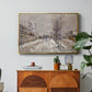 The Boulevard de Pontoise at Argenteuil, Snow Effect, 1875 by Claude Monet in a gold floater framed canvas featuring a snow-covered street lined with trees and buildings under winter sky, displayed above a wood console cabinet.