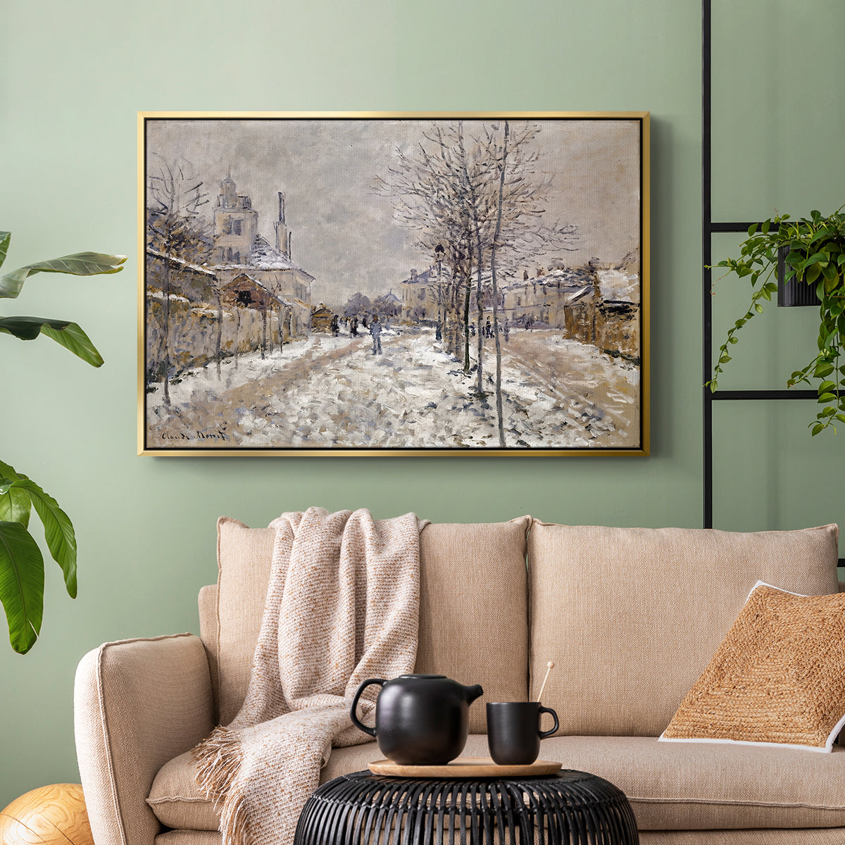 Gold floater framed canvas featuring an urban winter landscape with muted tones and soft light, displayed above a sofa in a modern living room.