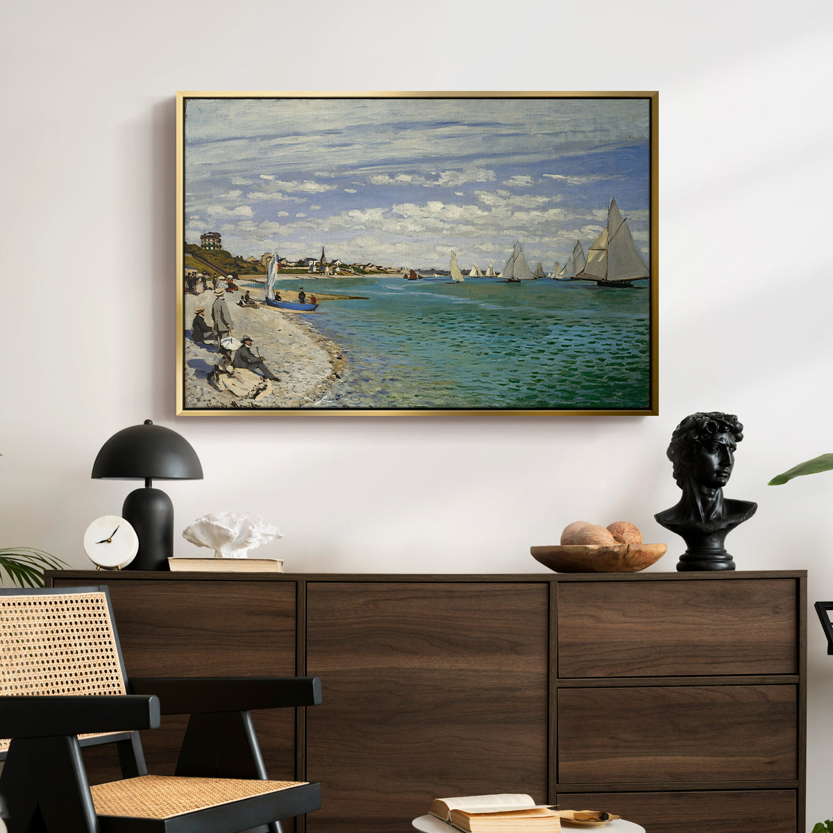 Regatta at Sainte-Adresse, 1867 by Claude Monet displayed in a gold floater framed canvas above a dark wood credenza in an entryway.