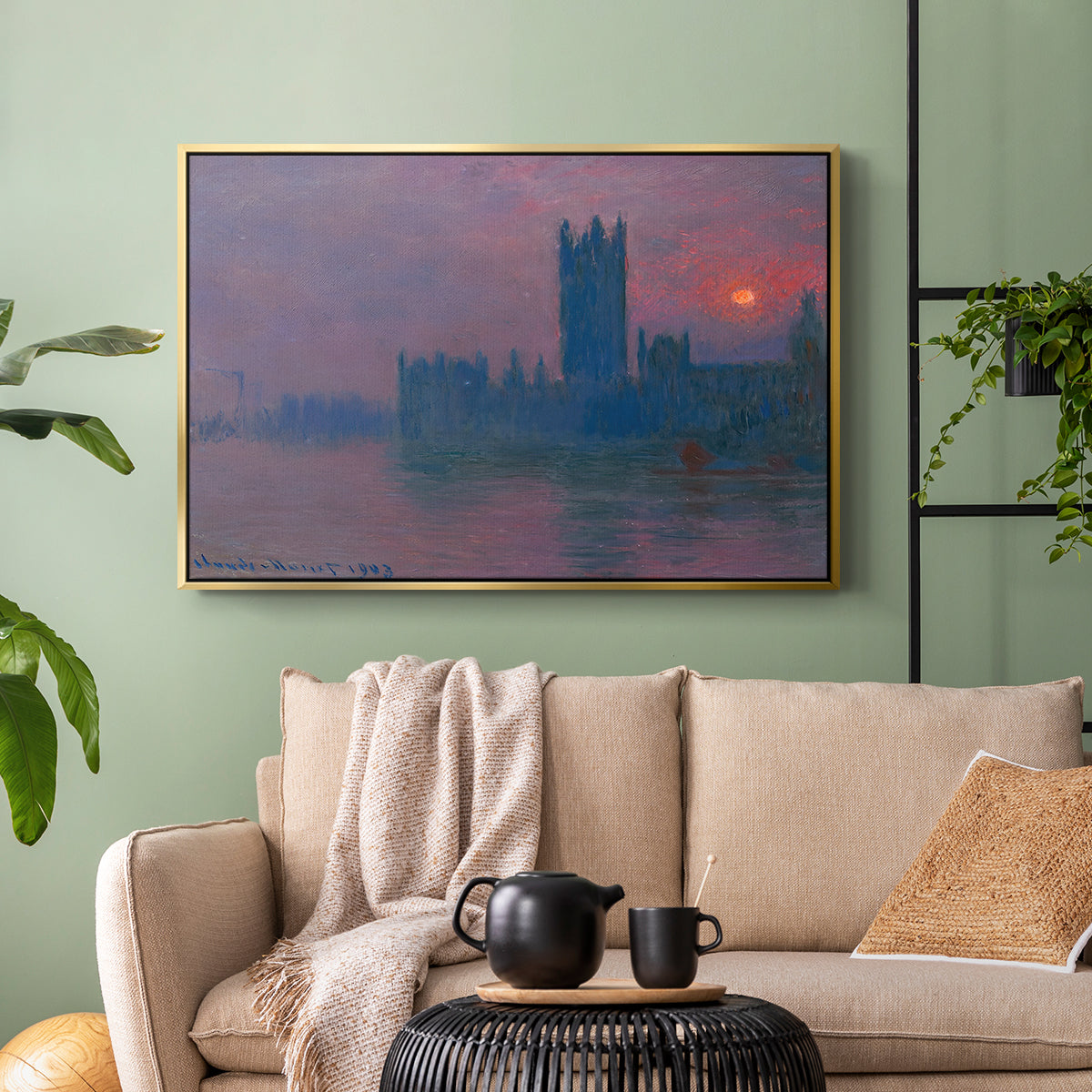 Gold floater framed canvas featuring a dramatic skyline with reflections under colorful sky, displayed above a sofa in a modern living room.