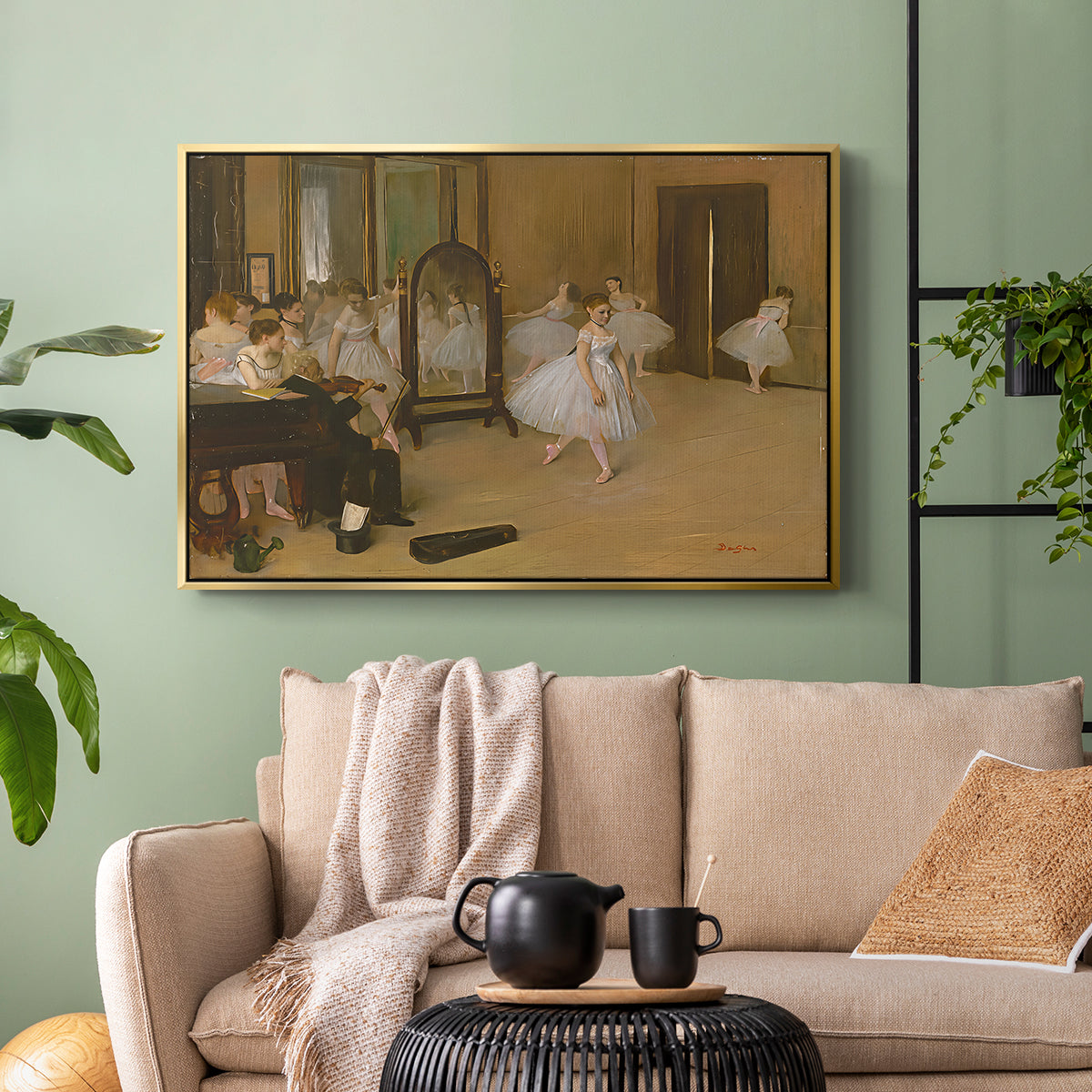 Gold floater framed canvas featuring a group of dancers mid-practice with teacher overseeing, displayed above a sofa in a modern living room.