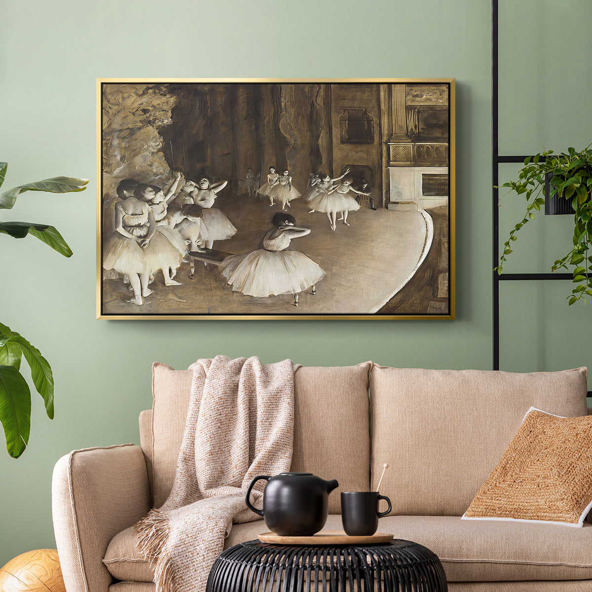 Gold floater framed canvas featuring dancers arranged on stage with visible set and depth, displayed above a sofa in a modern living room.