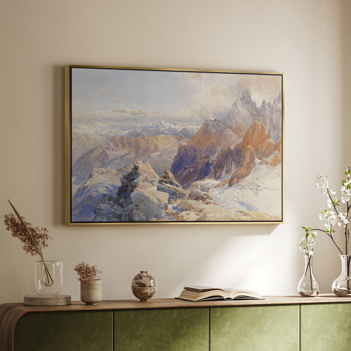 Gold floater framed canvas of Col du Géant, 1903 by Edward Theodore Compton, featuring a high mountain landscape featuring dramatic ridges and glacier terrain above a sideboard in a softly lit hallway.