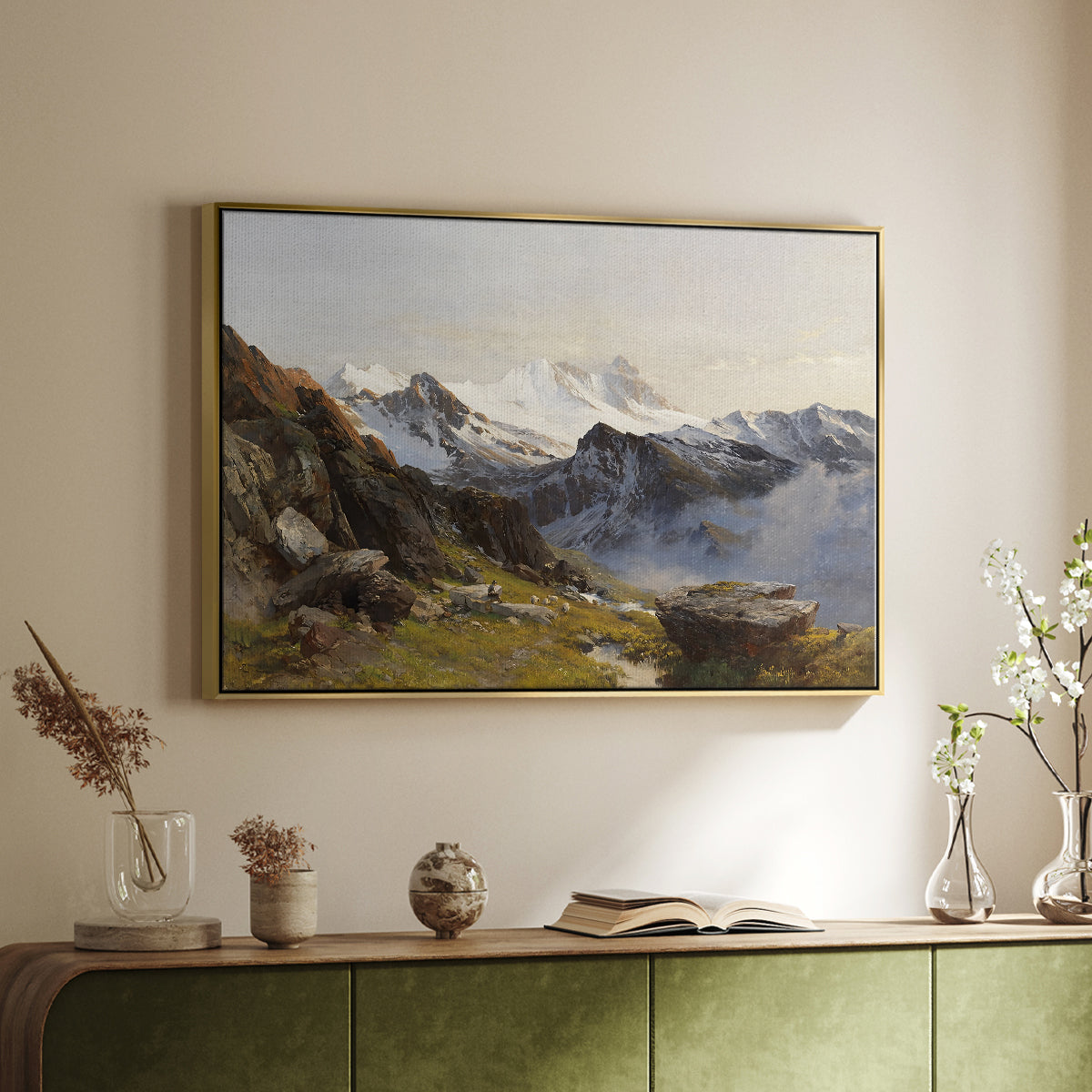 Gold floater framed canvas of The Großglockner from the Prager Hut, 1890 by Edward Theodore Compton, featuring a mountain summit seen from elevated viewpoint with surrounding landscape above a sideboard in a softly lit hallway.