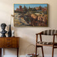Palatine in Rome, c. 1921 by Edward Theodore Compton as a gold floater framed canvas featuring a cityscape with classical ruins and surrounding terrain, styled above a mid-century console in a contemporary living area.