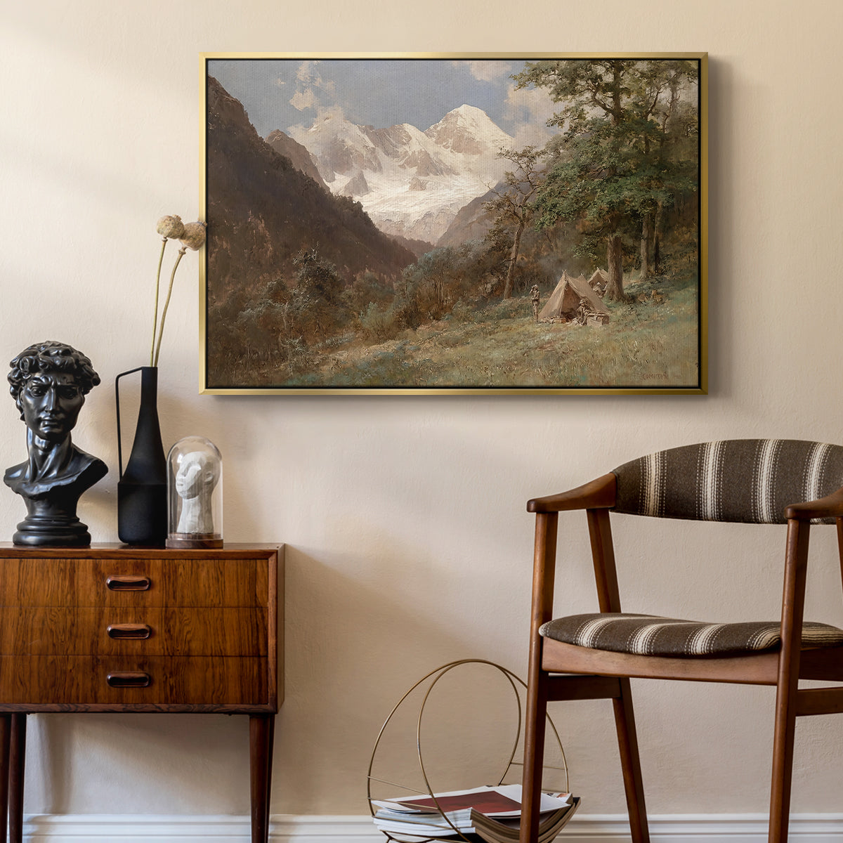 Landscape in the Caucasus, c. 1921 by Edward Theodore Compton as a gold floater framed canvas featuring a natural scene with valleys and rocky formations, styled above a mid-century console in a contemporary living area.