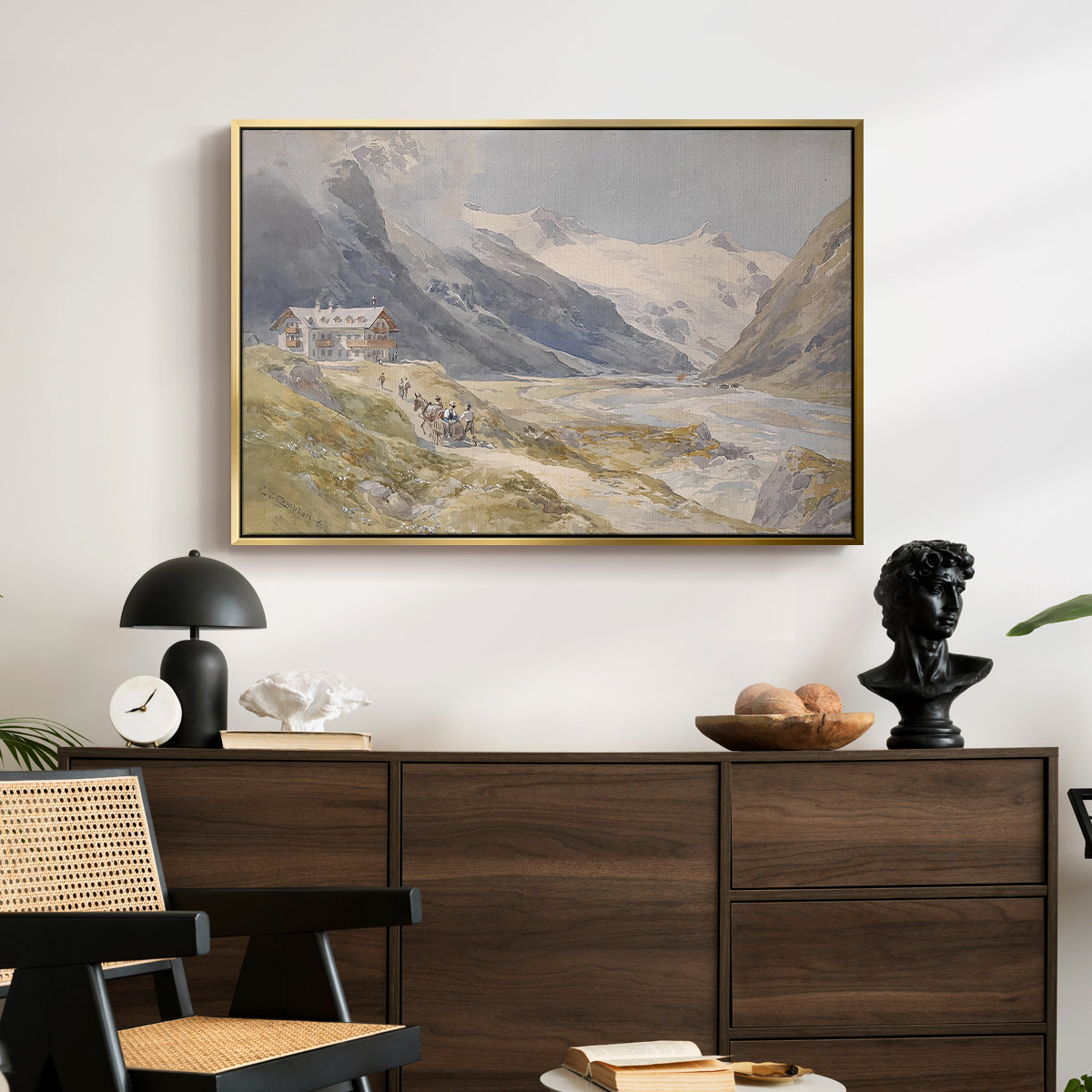 Shepherds (Pasterze), c. 1921 by Edward Theodore Compton displayed in a gold floater framed canvas above a dark wood credenza in an entryway.