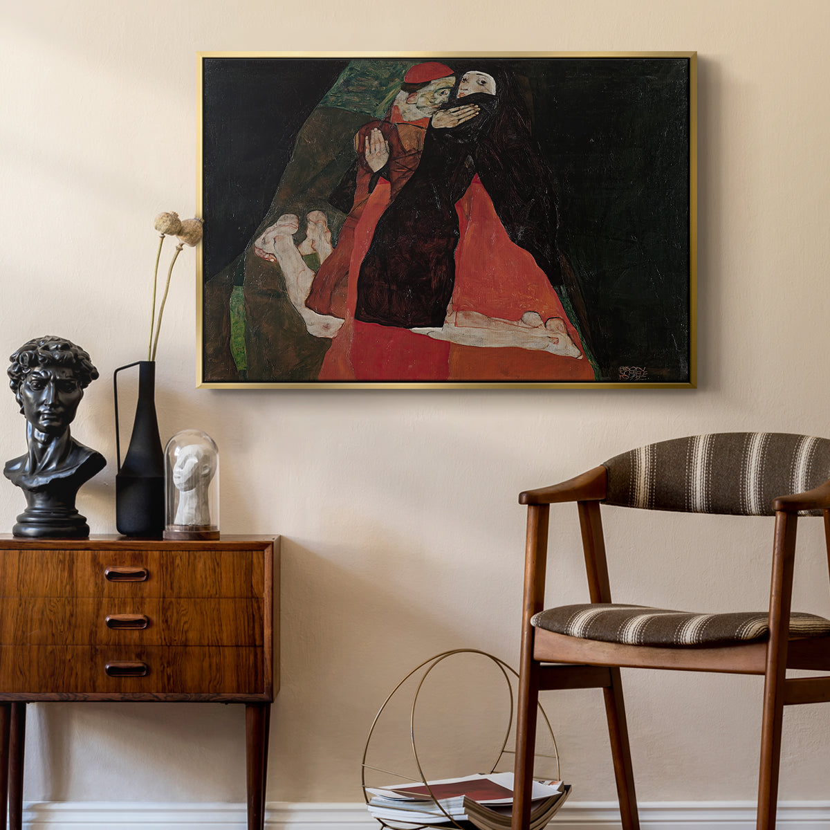Cardinal and Nun (Caress), 1912 by Egon Schiele as a gold floater framed canvas featuring an expressive painting of figures entwined with bold lines and color, styled above a mid-century console in a contemporary living area.