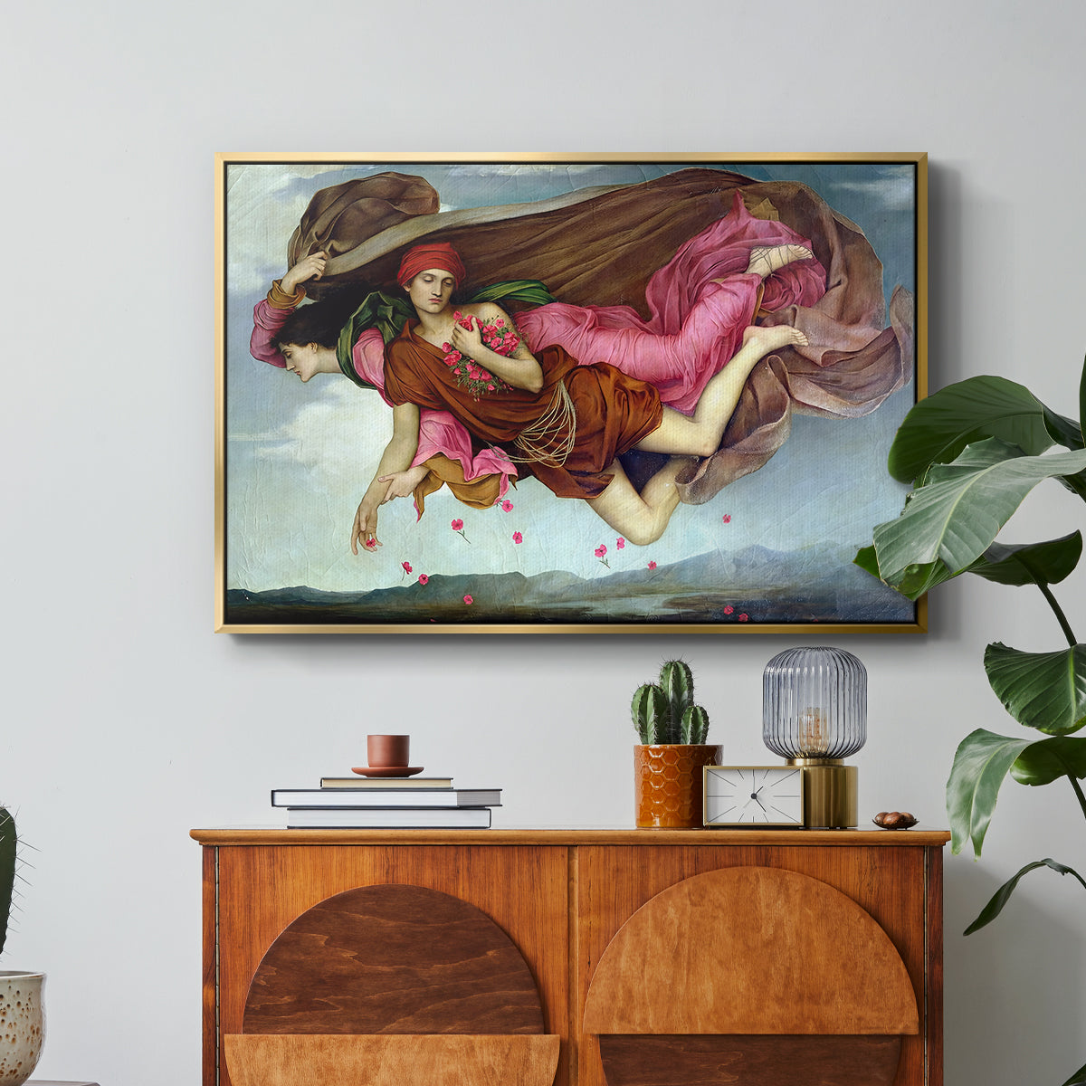 Night and Sleep, 1878 by Evelyn De Morgan in a gold floater framed canvas featuring two intertwined female figures floating through dark sky representing night and sleep, displayed above a wood console cabinet.