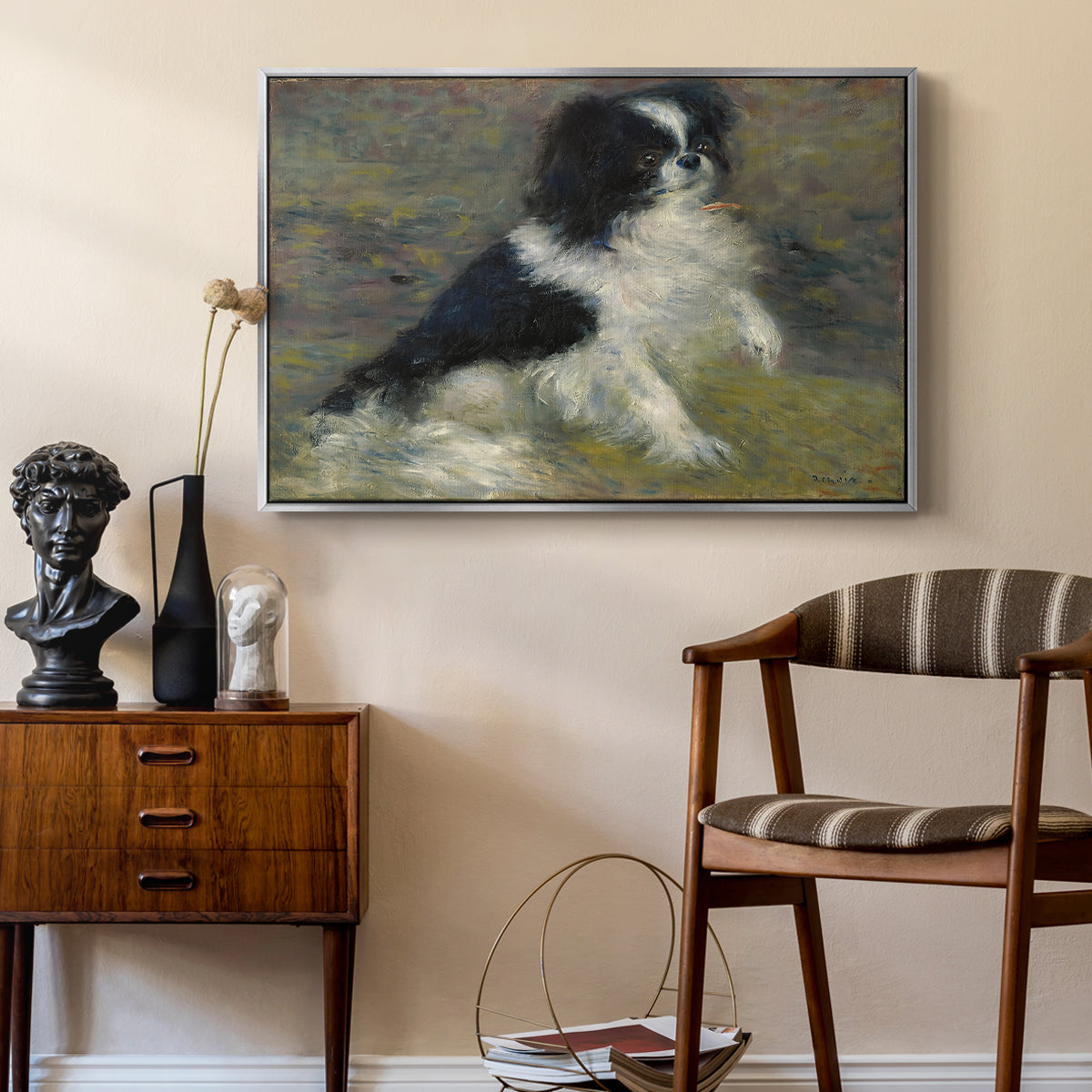 Tama, the Japanese Dog, c. 1876 by Pierre-Auguste Renoir as a silver floater framed canvas featuring a close-up of a small dog in motion surrounded by rippling water, styled above a mid-century console in a contemporary living area.