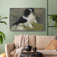 Silver floater framed canvas featuring an animal portrait of a dog in natural outdoor setting with soft light, displayed above a sofa in a modern living room.
