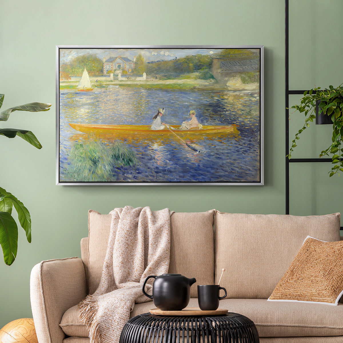 Silver floater framed canvas featuring a leisure scene of figures in a small rowboat on tranquil water, displayed above a sofa in a modern living room.